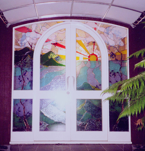 the front door stained glass enteranceway