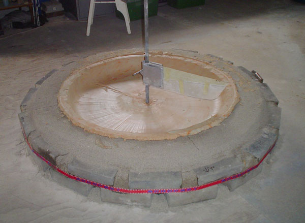 Dish being made in it's sand pit.